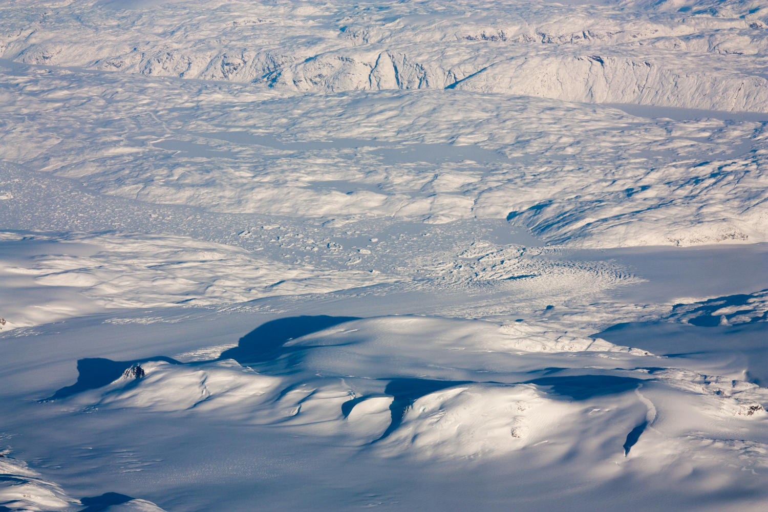 View of the ice along the coast of Greenland as seen from the flight (Photo credit: Luke Trusel) 